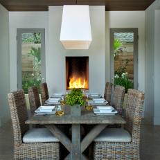 An Open Air Dining Room With Fireplace And Garden Courtyard Views