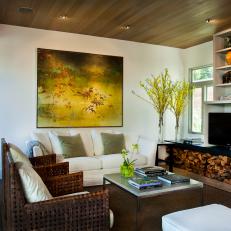 A Floral Painting and Firewood Complement A Villa Home's Gardens Through Interior Design