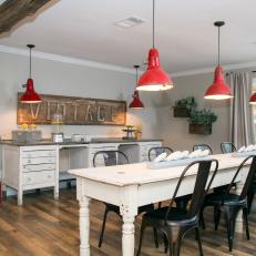 Renovated Dining Room With Red Industrial Pendant Lights 