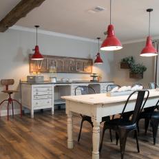 Dining/ Crafts Room With Red Pendant Lights 