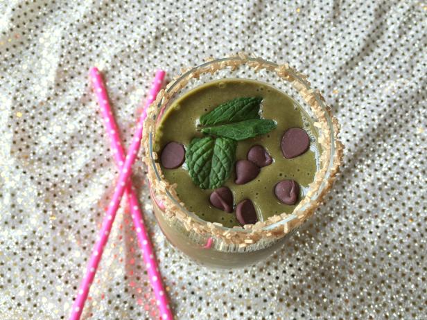 healthy shamrock shake with a gold sprinkles rim