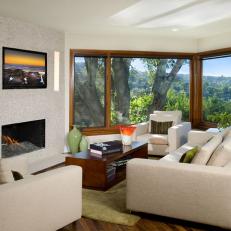 Fresh Transitional Living Room Features Neutral Sofa, Armchairs & Fireplace