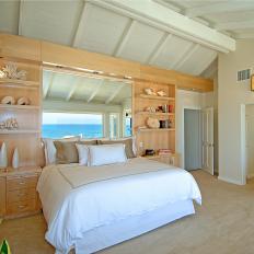 Neutral Coastal Bedroom With Vaulted Ceiling