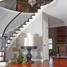 Eclectic Foyer Features Eastern Accents & Spiral Staircase