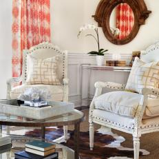 Transitional Living Room Features Vintage Armchairs