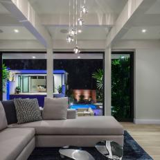 Gray Modern Living Room With Open Patio Door