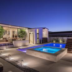 Patio at Night With Pool and Raised Hot Tub