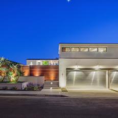 White Modern Home Exterior at Night