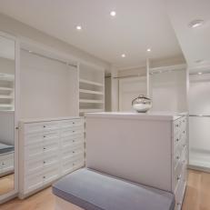 White Walk-In Closet and Gray Bench