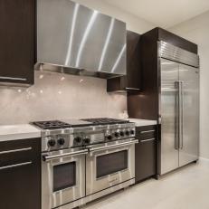 Brown and White Modern Chef's Kitchen With Wolf Oven