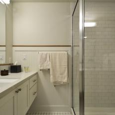 Simple Bathroom Features Glass Shower & Floating Vanity