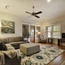 Cozy, Stylish Living Room Boasts Gray Sectional & Ottoman