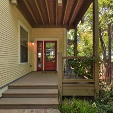 Entry to Remodeled Craftsman Home Features Bold Red Door