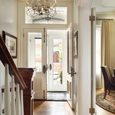 White Traditional Brownstone Foyer With Gold Chandelier