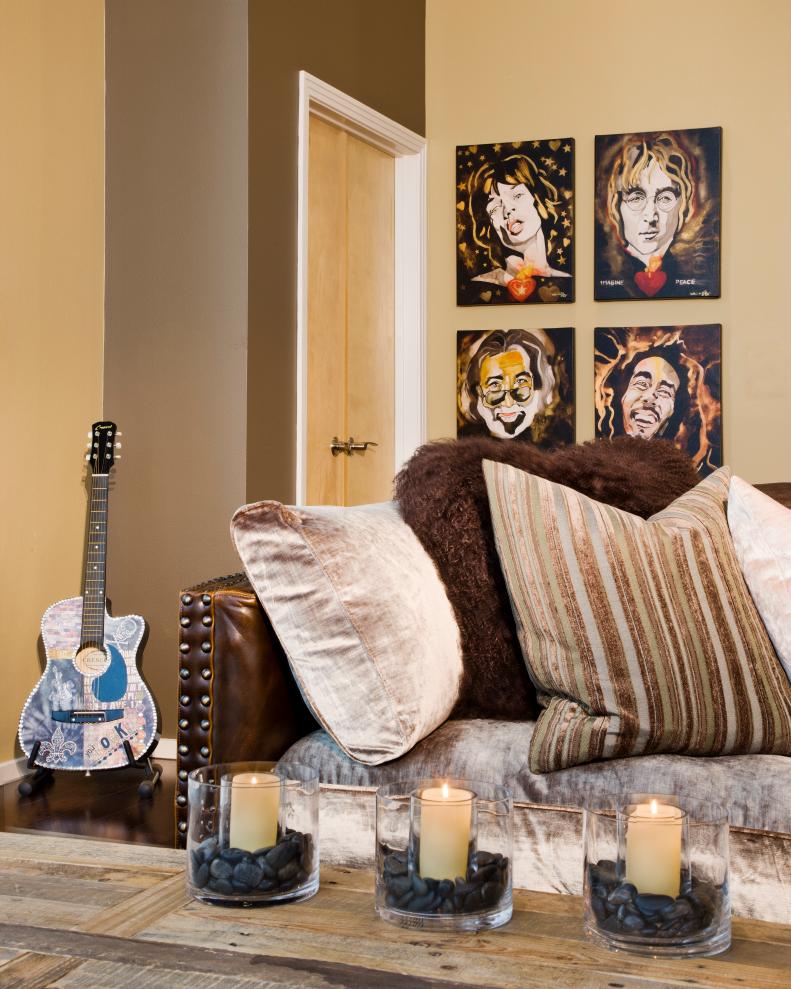 Tan Eclectic Living Room With Art, Guitar, Candles & Brown Pillows