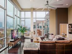 Neutral Contemporary Living Space With Brown Leather Sectional