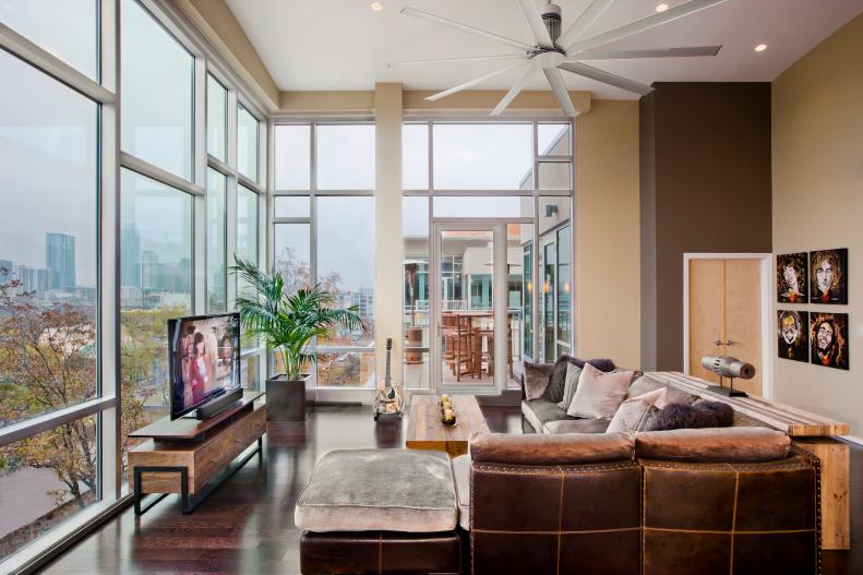 Neutral Contemporary Living Space With Brown Leather Sectional
