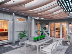 Covered Contemporary Patio With Plants, Gray Metal Furniture & Grill