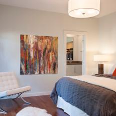 Simple Master Bedroom Features Colorful Original Art
