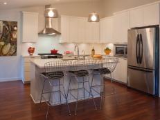 Simple White Kitchen With Trio of Metal Barstools