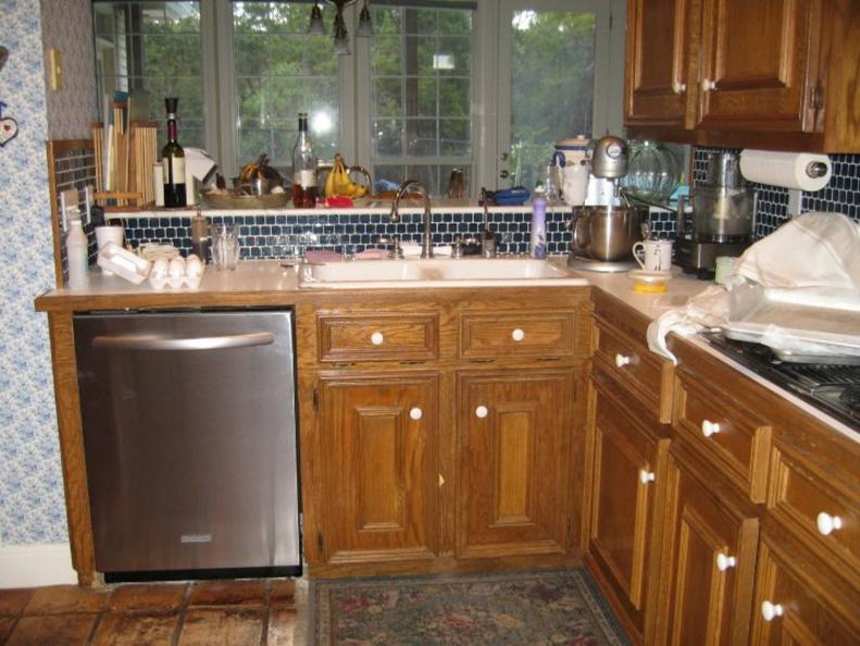 Messy Kitchen With Dated Brown Cabinets
