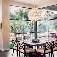 Open Concept Corner Dining Area With Backyard View