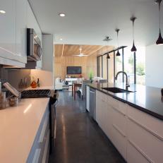 Modern Open Plan Kitchen Boasts Sleek, White Cabinets