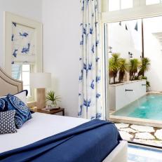 Blue and White Transitional Bedroom With Fish Print Curtains