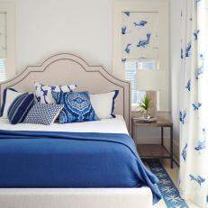 Blue and White Transitional Bedroom With Upholstered Bed
