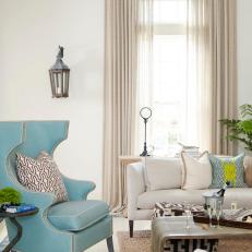 Neutral Transitional Living Room With Blue Armchair