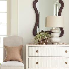 Coastal Vignette With White Dresser and Chair