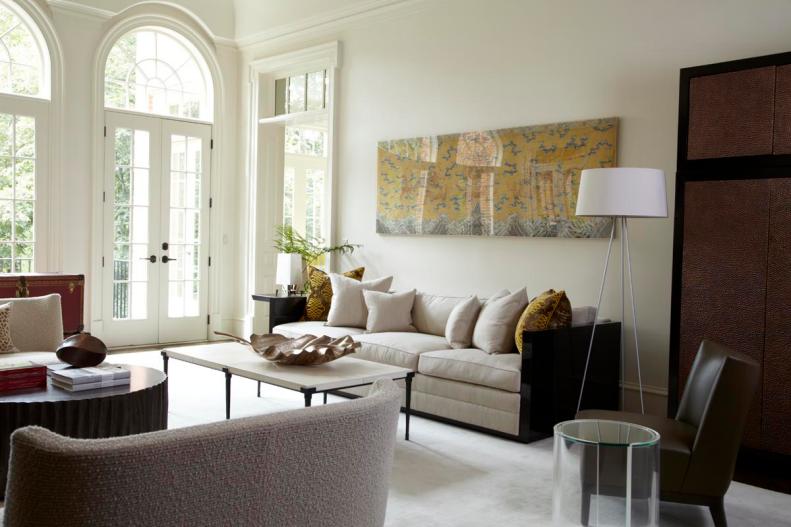 Neutral Asian Living Room With Neutral Furniture and Yellow Art