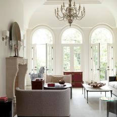 Bright, Transitional Living Room With French Doors & Large Chandelier