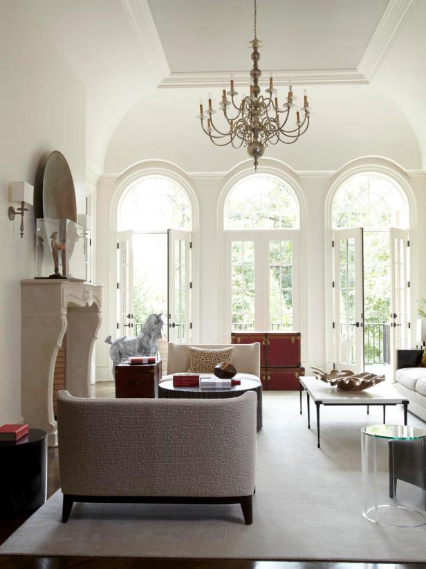 White Transitional Living Room With Arched Windows & Asian Decor