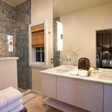 Neutral Bathroom With Gray-Tiled Shower