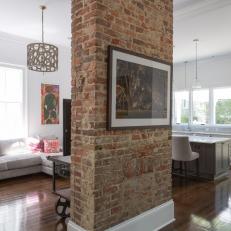 White Open Plan Living Room With Brick Column