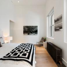 Crisp, White Apartment Master Bedroom With Black and White Accessories