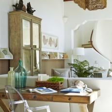 Chic Wooden Desk & Lucite Armchair in Coastal Living Room