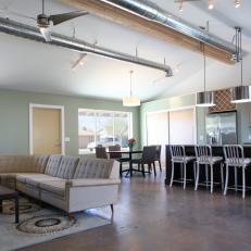 Open Concept Industrial Living Space With Concrete Floors
