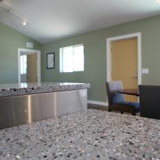 Gray Speckled Granite Countertop and Yellow Door