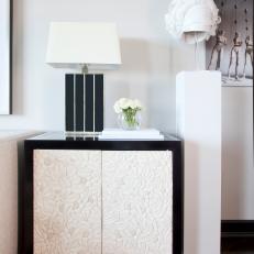 Contemporary Lamp Atop Floral Black & White End Table
