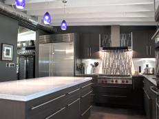 Black and Gray Contemporary Kitchen With Stainless Steel Refrigerator