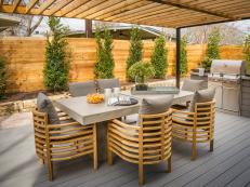 With a charming pergola and enough space for a teak dining table and the ultimate grill station, the deck off the living room is a stylish spot to entertain outdoors.