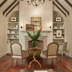 Traditional Sitting Room With Cream Fireplace & Built-Ins