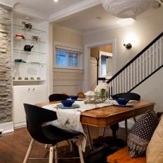 Dining Room with Shelving and a Stone Focal Wall 