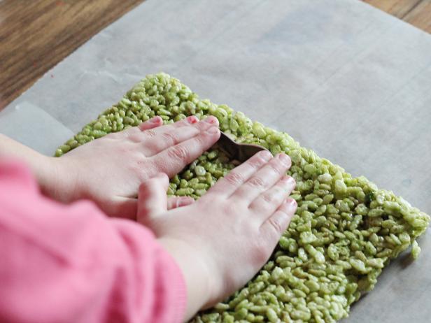 Cut spinach-dyed Rice Krispies treats using a shamrock cookie cutter.