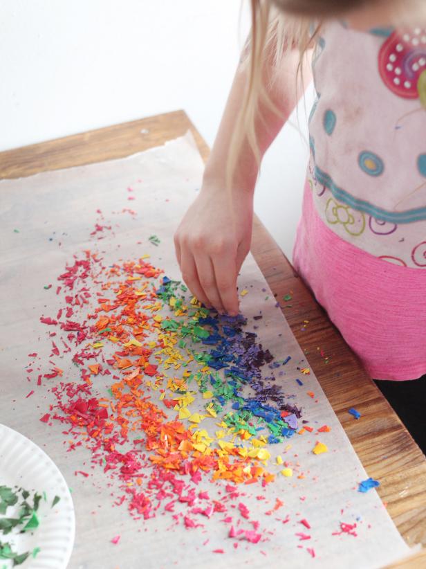 crayon shavings placed on wax paper in rainbow pattern