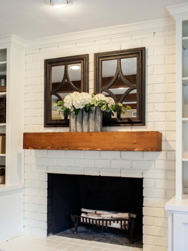 Black Accent Mirrors Above Redwood Mantel 