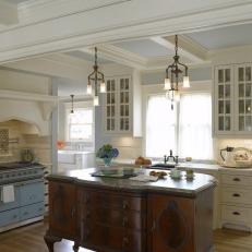 French-Inspired Kitchen Features Antique Wooden Island