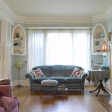 Light Blue Living Room Features Gothic Shelves